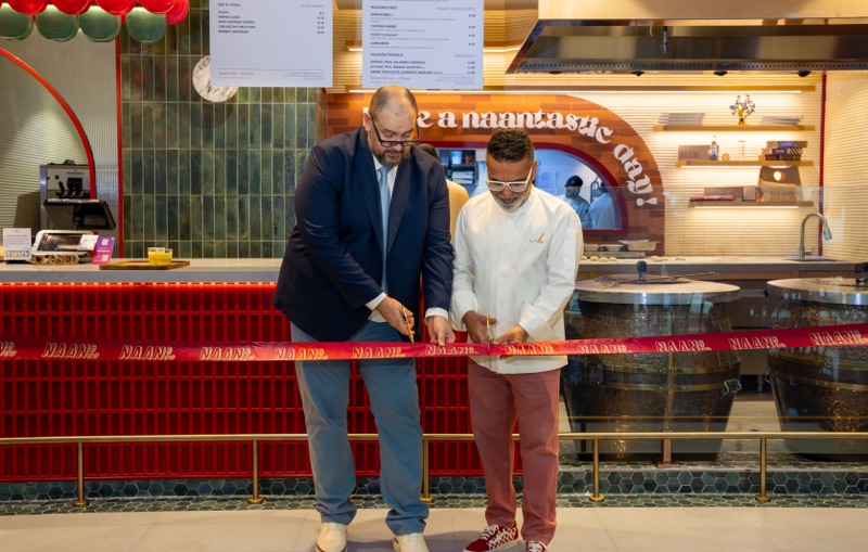 Chef Vineet Bhatia and an Emirates Flight Catering executive opening Naan & Co