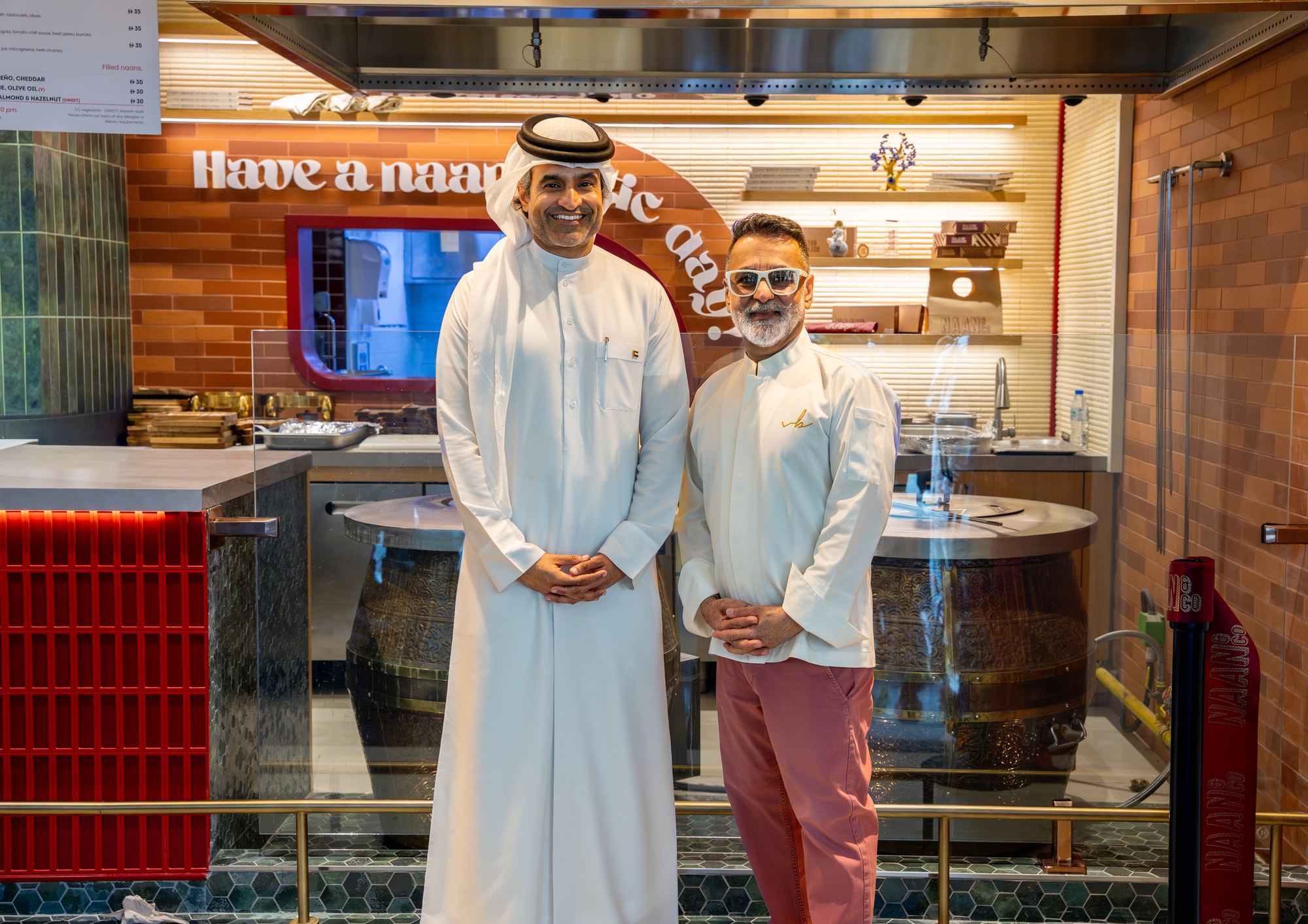 Chef Vineet Bhatia with Emirates Flight Catering leadership at the Naan & Co counter